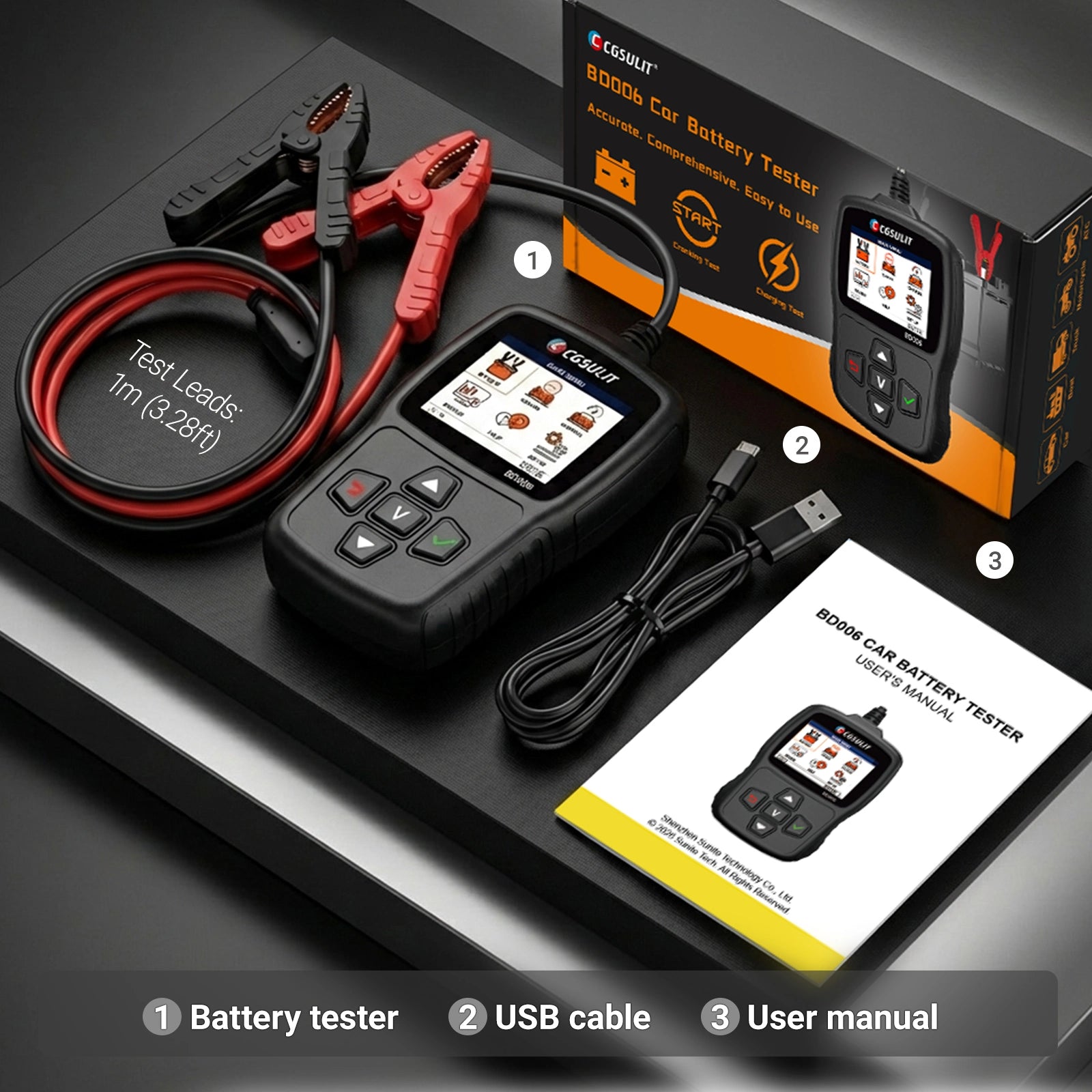 Car battery tester with test leads, USB cable, and user manual on a dark surface